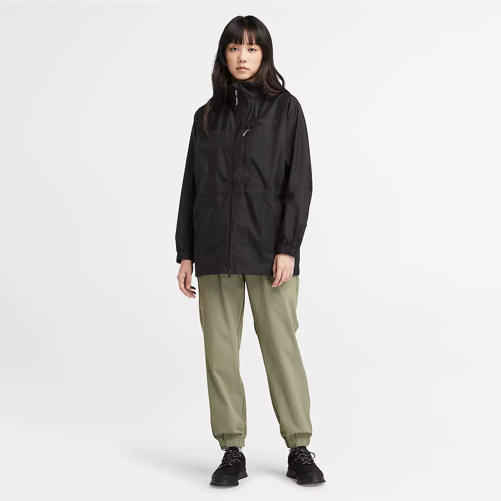 Black Timberland¡ Women's Jenness Waterproof Packable Jacket. Lightweight, waterproof fabric for breathability and protection. Tier 3 waterproof technology with fully sealed seams for dryness. Packable design folds into a pouch for portability. Adjustable hood for extra coverage.