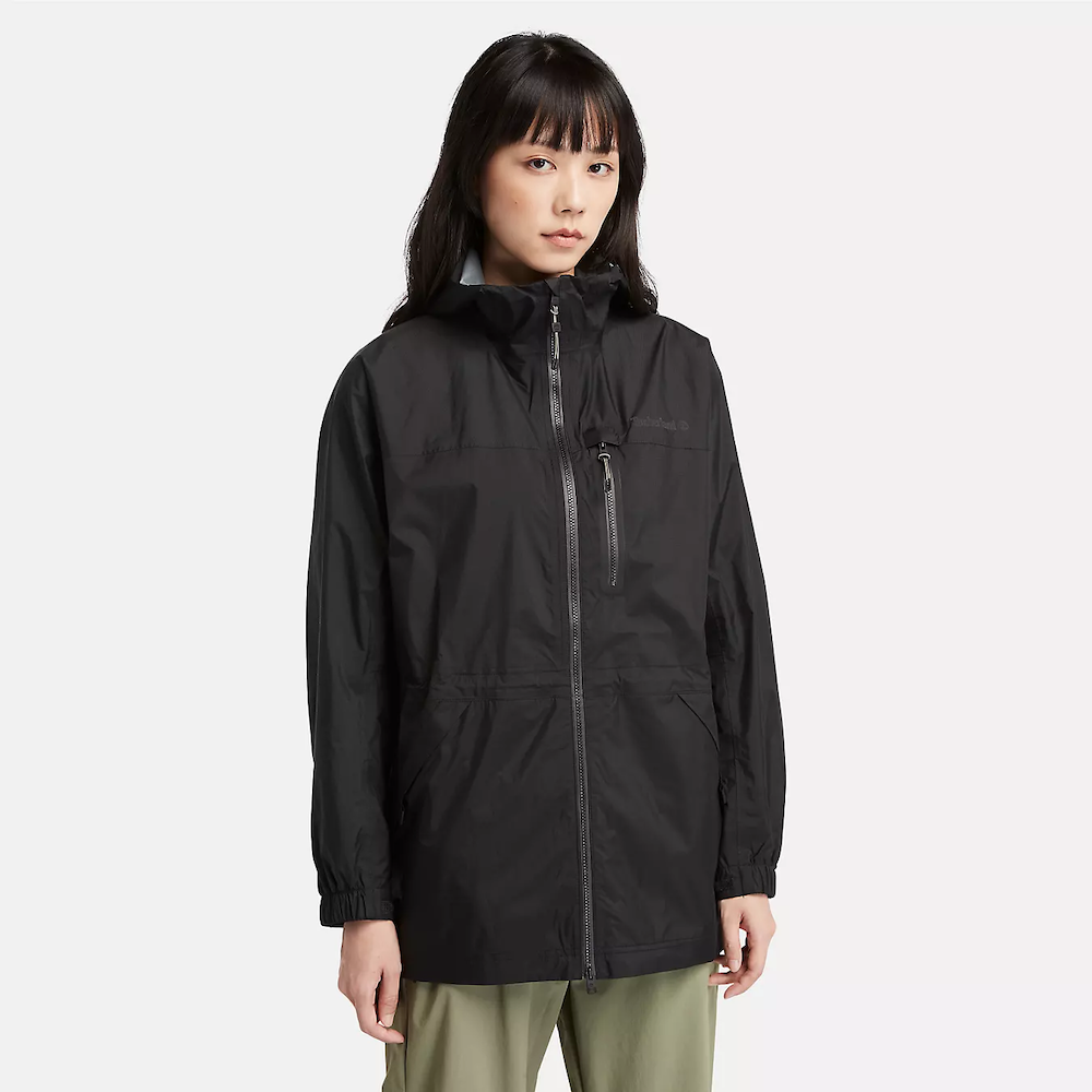 Black Timberland® Women's Jenness Waterproof Packable Jacket. Lightweight, waterproof fabric for breathability and protection. Tier 3 waterproof technology with fully sealed seams for dryness. Packable design folds into a pouch for portability. Adjustable hood for extra coverage.