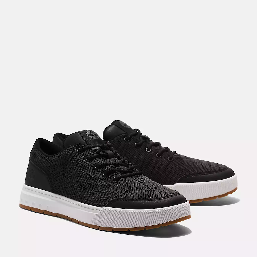 Black Timberland Maple Grove Low Lace-Up Sneaker for Men. Recycled PET upper, lining for comfort. Lace-up fit, flexible midsole. Sleek black upper, durable outsole.