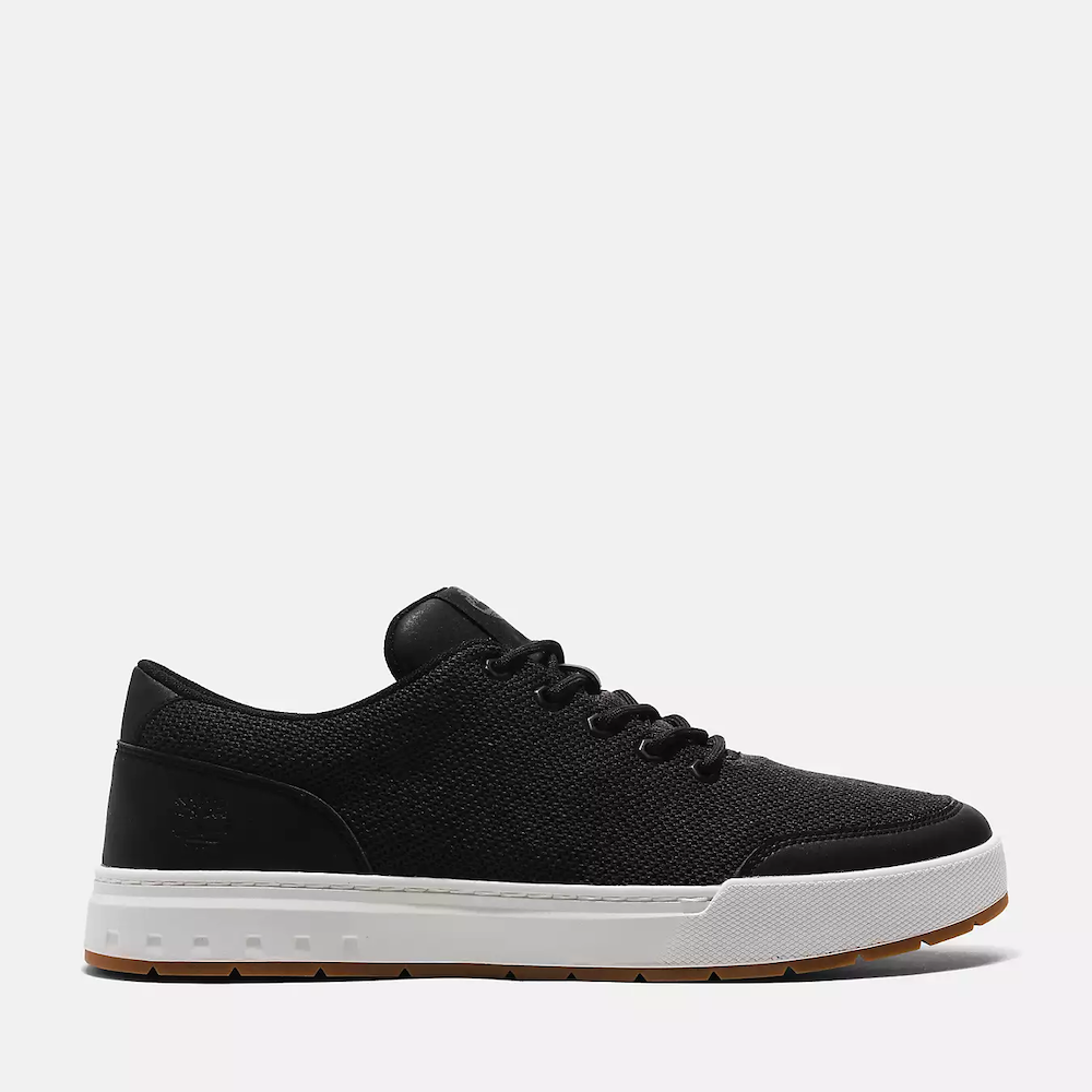 Black Timberland Maple Grove Low Lace-Up Sneaker for Men. Recycled PET upper, lining for comfort. Lace-up fit, flexible midsole. Sleek black upper, durable outsole.