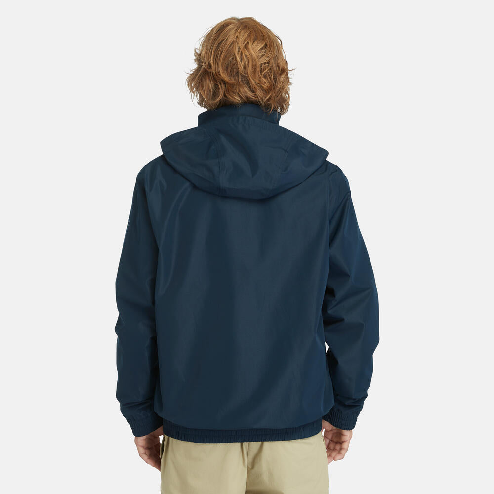 Navy Timberland¡ Water Resistant Bomber Jacket for Men. Water-resistant fabric repels moisture. Durable construction for long-lasting wear. Regular fit for comfort. Ribbed cuffs and hem for a snug fit. Button-up front closure. Side pockets and utility sleeve pocket. Classic navy color for versatility.