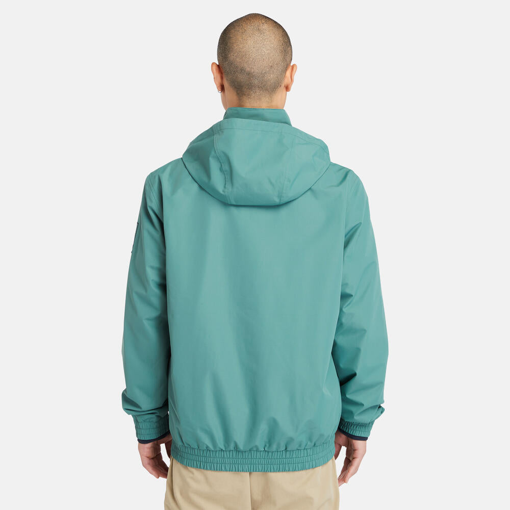 Teal Timberland¡ Water Resistant Bomber Jacket for Men.¡Water-resistant fabric repels moisture.¡Durable construction for long-lasting wear.¡Regular fit for comfort.¡Ribbed cuffs and hem for a snug fit.¡Button-up front closure.¡Side pockets and utility sleeve pocket