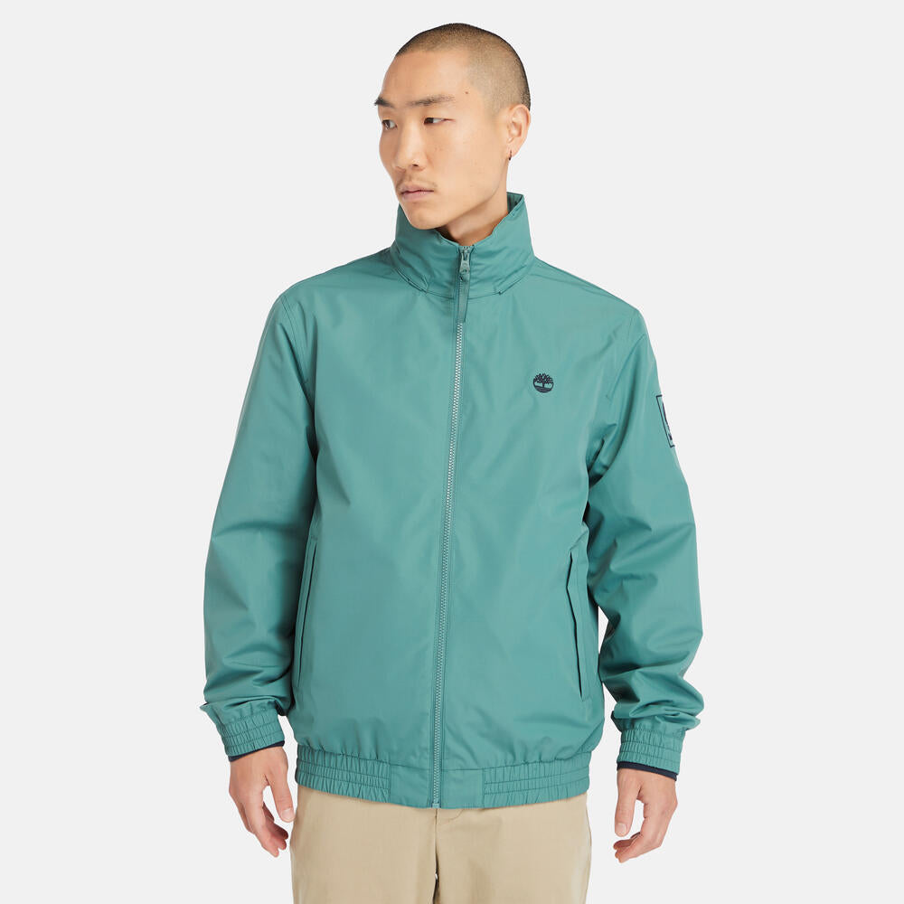 Teal Timberland€š® Water Resistant Bomber Jacket for Men.€šWater-resistant fabric repels moisture.€šDurable construction for long-lasting wear.€šRegular fit for comfort.€šRibbed cuffs and hem for a snug fit.€šButton-up front closure.€šSide pockets and utility sleeve pocket