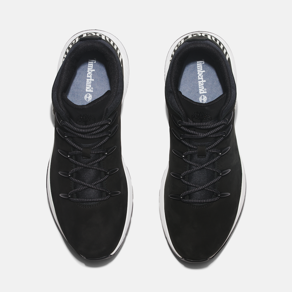 Black Timberland Sprint Trekker Men's Hiker. Mid-height black hiking boot with mixed-media upper for durability and eco-consciousness. Lightweight design for comfort. Cushioned footbed, supportive midsole, lace-up closure for fit. Durable outsole for traction on trails.