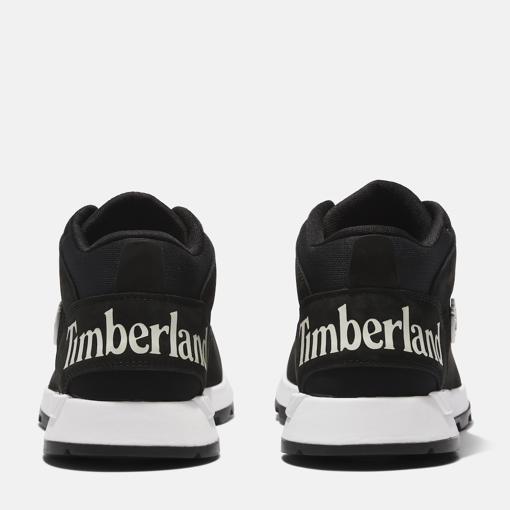 Black Timberland Sprint Trekker Men's Hiker. Mid-height black hiking boot with mixed-media upper for durability and eco-consciousness. Lightweight design for comfort. Cushioned footbed, supportive midsole, lace-up closure for fit. Durable outsole for traction on trails.