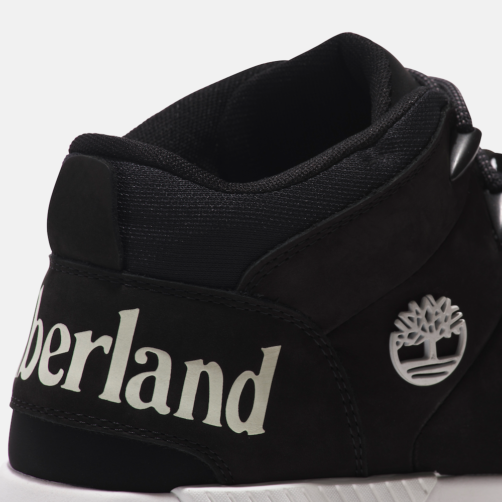 Black Timberland Sprint Trekker Men's Hiker. Mid-height black hiking boot with mixed-media upper for durability and eco-consciousness. Lightweight design for comfort. Cushioned footbed, supportive midsole, lace-up closure for fit. Durable outsole for traction on trails.