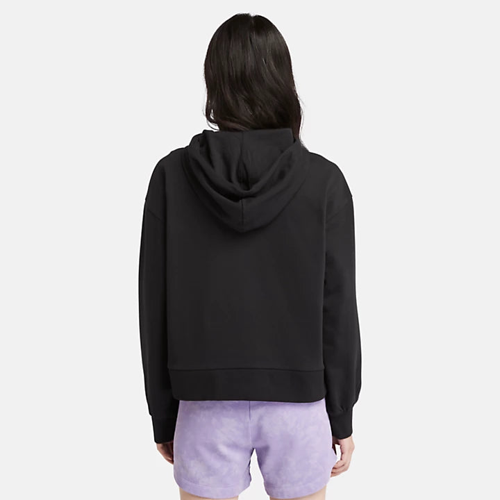 Black Timberland Women's Loopback Hoodie. Made with 80% cotton for softness and breathability. Dropped-shoulder silhouette for a relaxed, modern look. Drawcord-adjustable hood for warmth and coverage