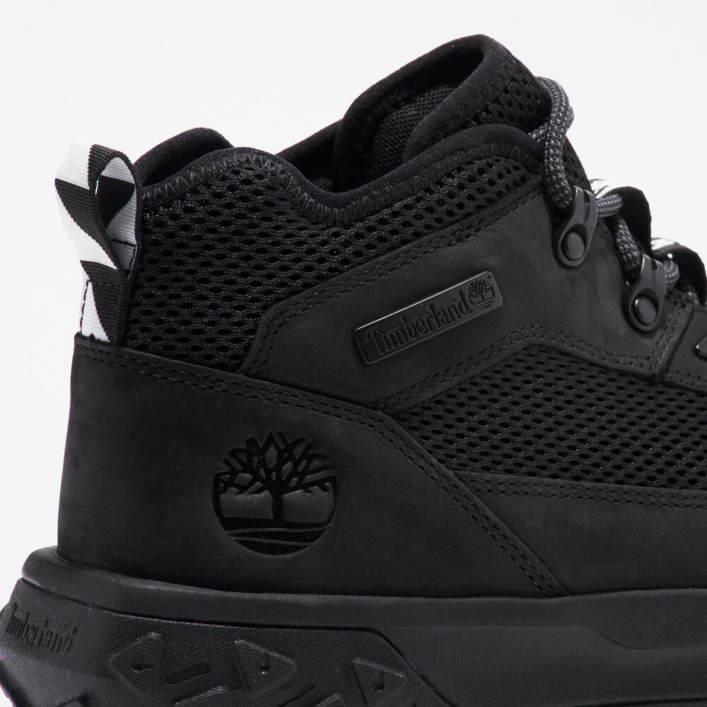Timberland GreenStride Motion 6 Sneaker Boot for Men in Black. Black sneaker boot for all-day comfort and style. GreenStride midsole for eco-conscious cushioning. ReBOTL recycled lining. Supportive design with lace-up closure. Rubber outsole for everyday traction. Versatile for everyday wear, light hikes, or city adventures.