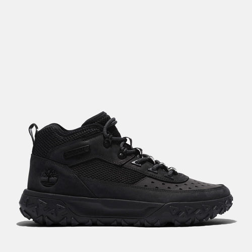 Timberland GreenStride Motion 6 Sneaker Boot for Men in Black. Black sneaker boot for all-day comfort and style. GreenStride midsole for eco-conscious cushioning. ReBOTL recycled lining. Supportive design with lace-up closure. Rubber outsole for everyday traction. Versatile for everyday wear, light hikes, or city adventures.