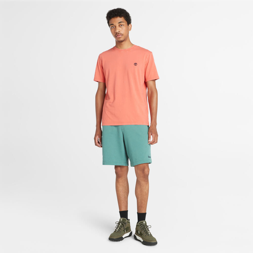 Timberland® Northwood Logo Cargo Brushback Sweatshort. Men's cargo shorts with a brushback interior for warmth. Features cargo pockets and a relaxed fit. Ideal for casual wear and outdoor activities.