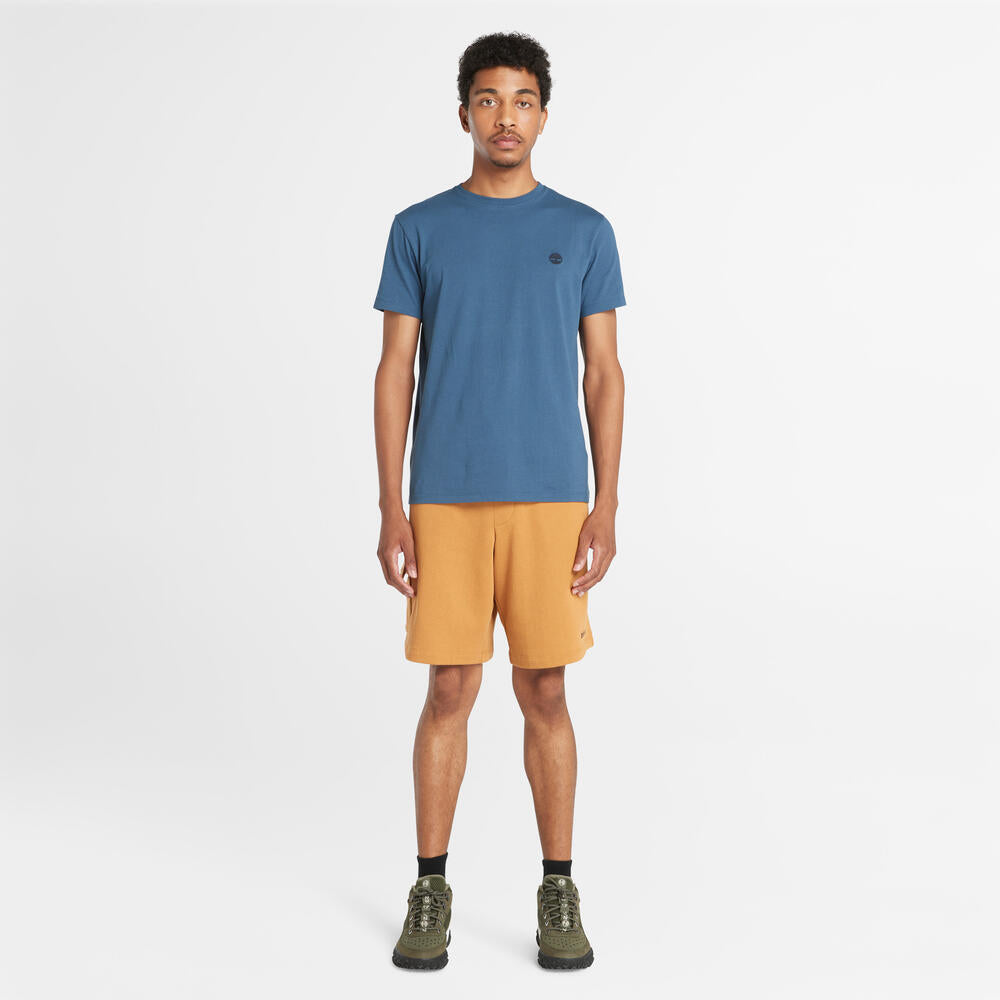 Timberland® Northwood Logo Cargo Brushback Sweatshort. Men's cargo shorts with a brushback interior for warmth. Features cargo pockets and a relaxed fit. Ideal for casual wear and outdoor activities.