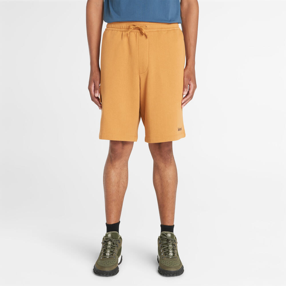 Timberland® Northwood Logo Cargo Brushback Sweatshort. Men's cargo shorts with a brushback interior for warmth. Features cargo pockets and a relaxed fit. Ideal for casual wear and outdoor activities.