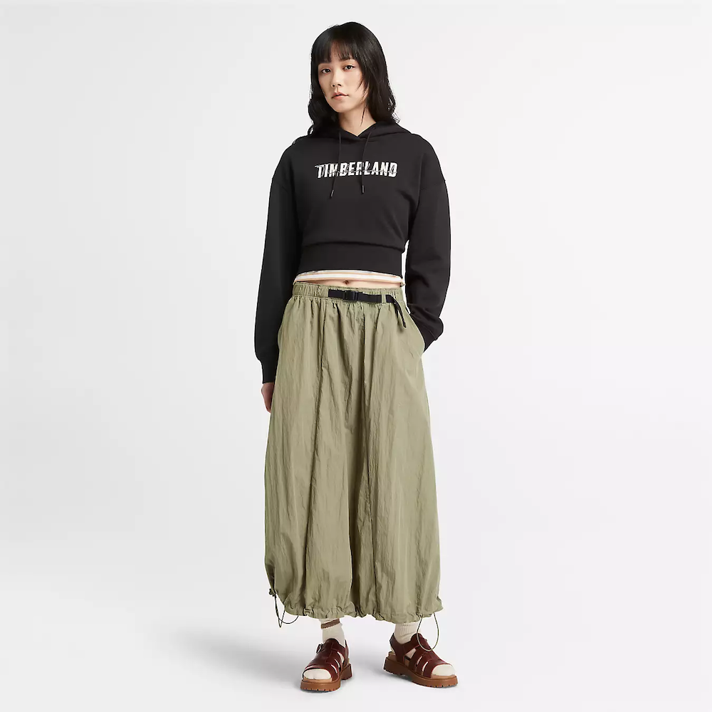 Black Timberland Brushed Back Logo Hoodie for Women. Soft, breathable cotton blend with brushed-back fleece for warmth. Relaxed fit, cropped silhouette (18.0" center back length). Adjustable hood for warmth and coverage. Ribbed cuffs and hem for a snug fit