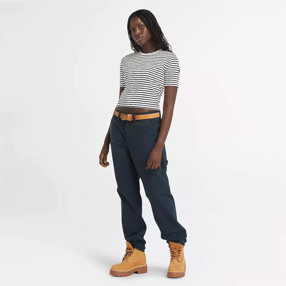 Striped Timberland® Crop Short Sleeve Tee for Women. Soft, breathable cotton blend fabric. Relaxed fit for comfort. Cropped silhouette for a trendy look. Ribbed collar for a snug fit. Classic striped pattern for nautical style