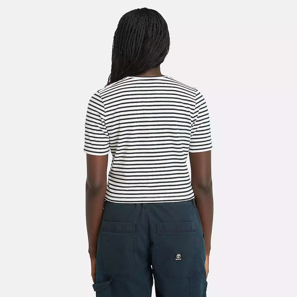 Striped Timberland Crop Short Sleeve Tee for Women. Soft, breathable cotton blend fabric. Relaxed fit for comfort. Cropped silhouette for a trendy look. Ribbed collar for a snug fit. Classic striped pattern for nautical style