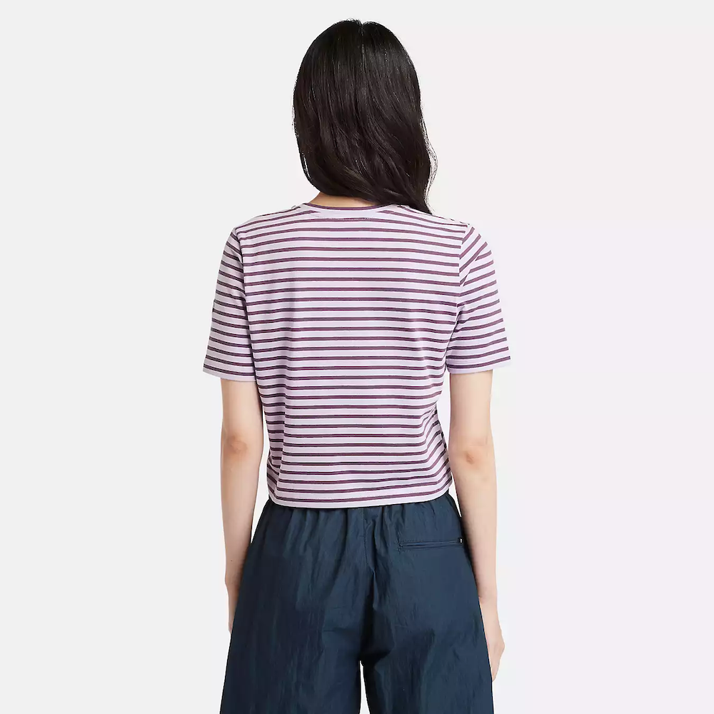 Striped Timberland® Crop Short Sleeve Tee for Women. Soft, breathable cotton blend fabric. Relaxed fit for comfort. Cropped silhouette for a trendy look. Ribbed collar for a snug fit. Classic striped pattern for nautical style