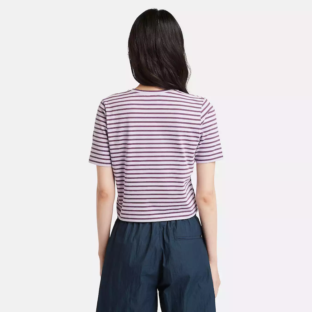 Striped Timberland Crop Short Sleeve Tee for Women. Soft, breathable cotton blend fabric. Relaxed fit for comfort. Cropped silhouette for a trendy look. Ribbed collar for a snug fit. Classic striped pattern for nautical style
