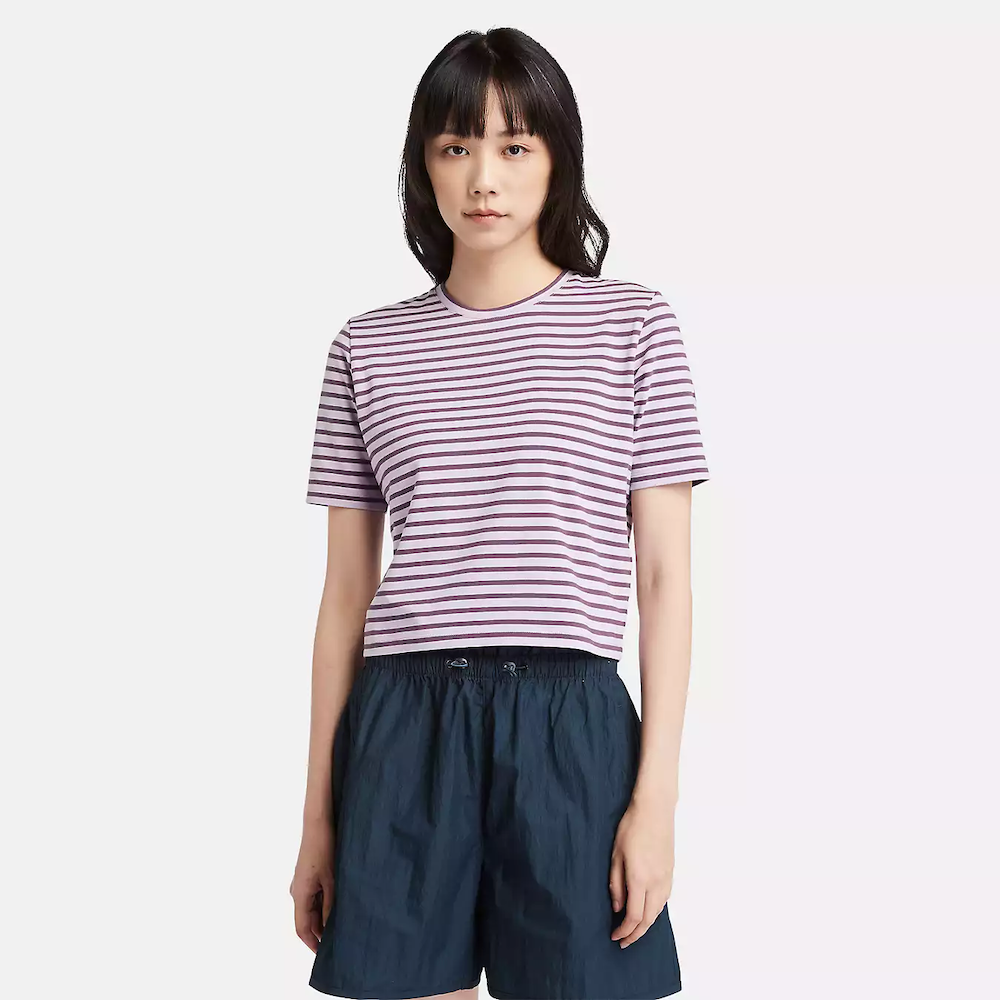 Striped Timberland Crop Short Sleeve Tee for Women. Soft, breathable cotton blend fabric. Relaxed fit for comfort. Cropped silhouette for a trendy look. Ribbed collar for a snug fit. Classic striped pattern for nautical style