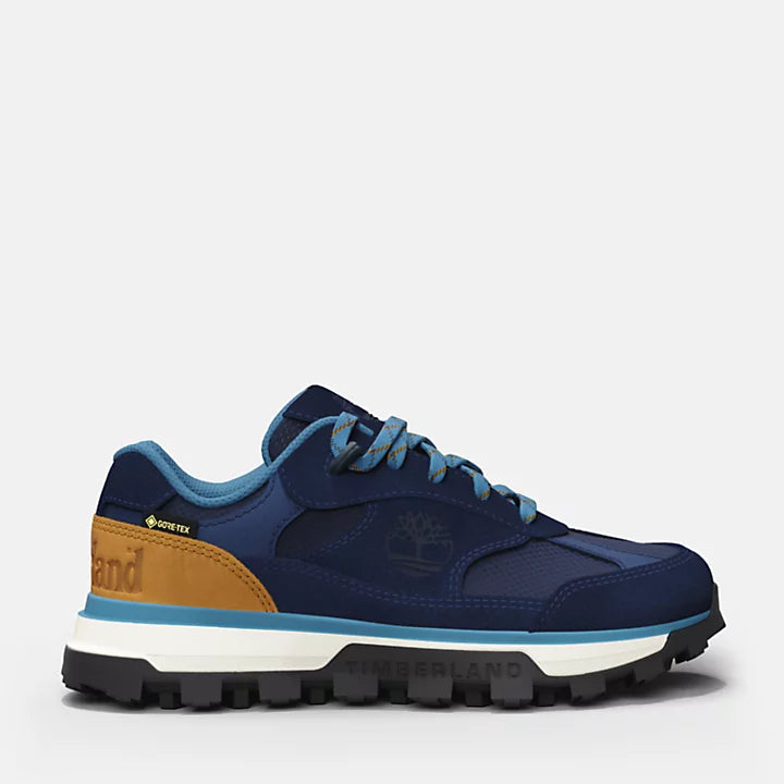 Navy Timberland® Trail Trekker Low GTX Sneaker for Youth. Waterproof Gore-Tex® bootie construction for dry feet. Durable upper for breathability and support. Padded collar for comfort, lace-up closure for secure fit. Lightweight midsole for shock absorption, durable outsole for traction.