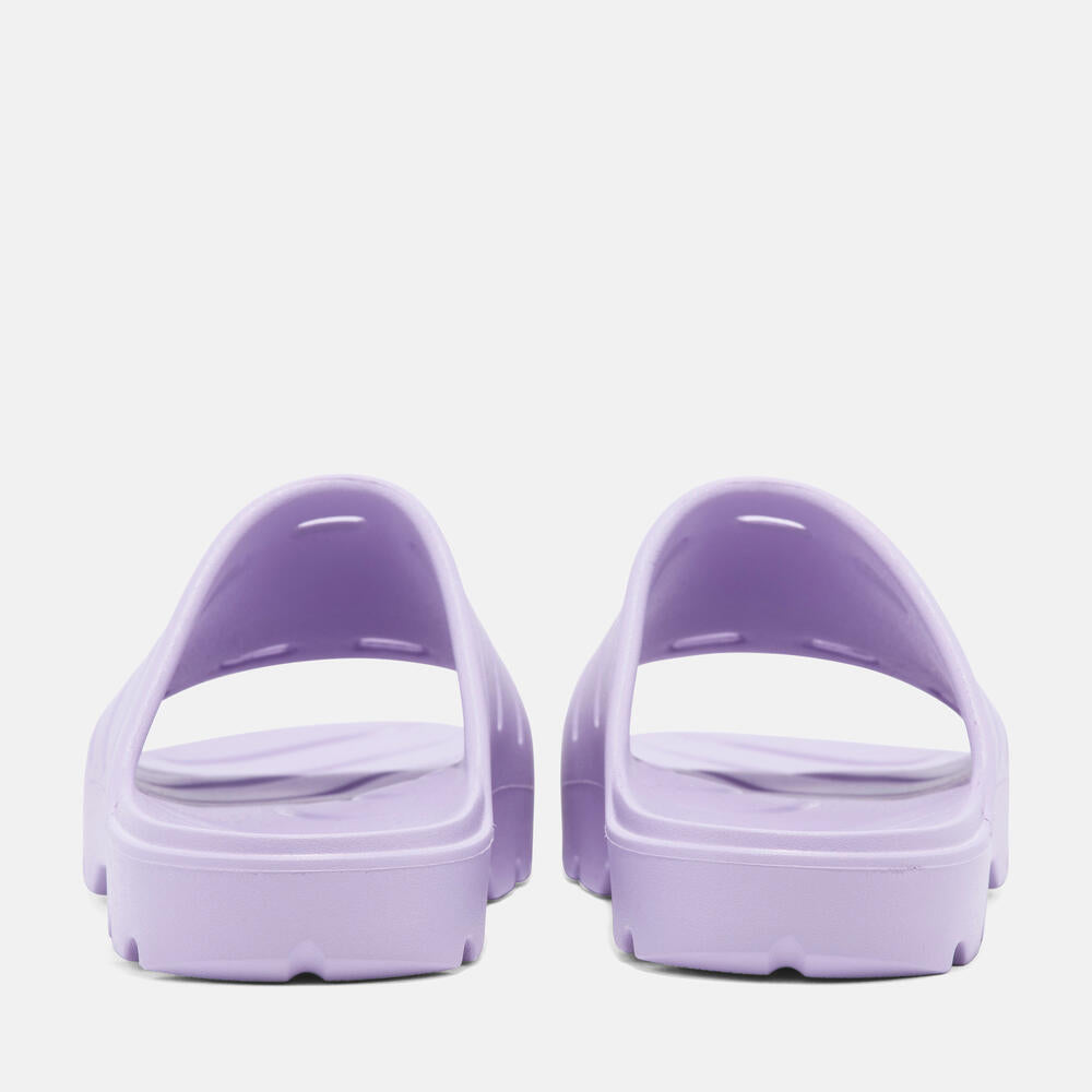 Timberland® Get Outslide Slide Sandal for Women in Purple. Purple slide sandal with one-piece EVA upper and outsole for lightweight comfort. Perfect for casual wear and lounging.