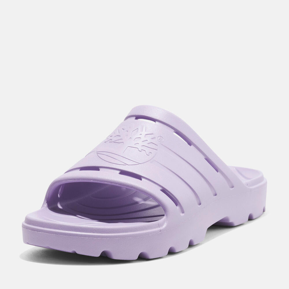 Timberland® Get Outslide Slide Sandal for Women in Purple. Purple slide sandal with one-piece EVA upper and outsole for lightweight comfort. Perfect for casual wear and lounging.