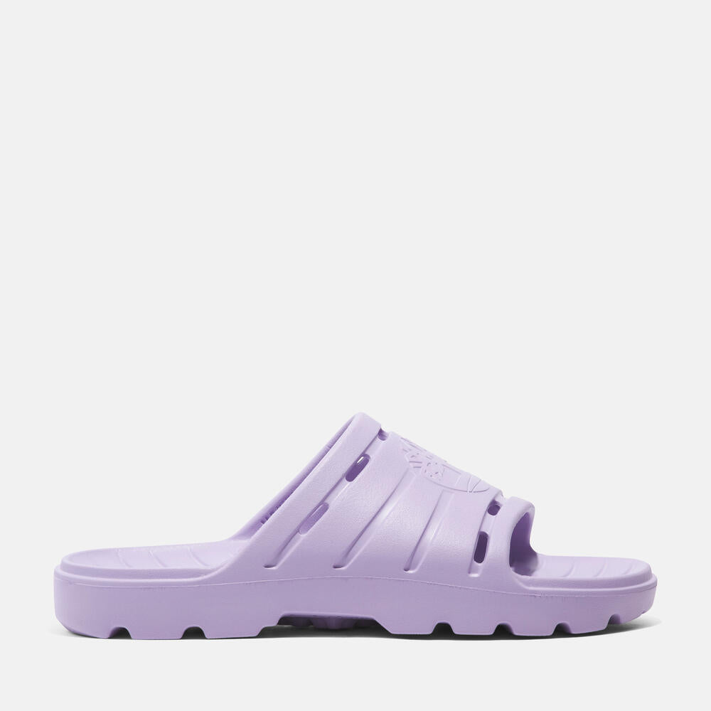 Timberland® Get Outslide Slide Sandal for Women in Purple. Purple slide sandal with one-piece EVA upper and outsole for lightweight comfort. Perfect for casual wear and lounging.