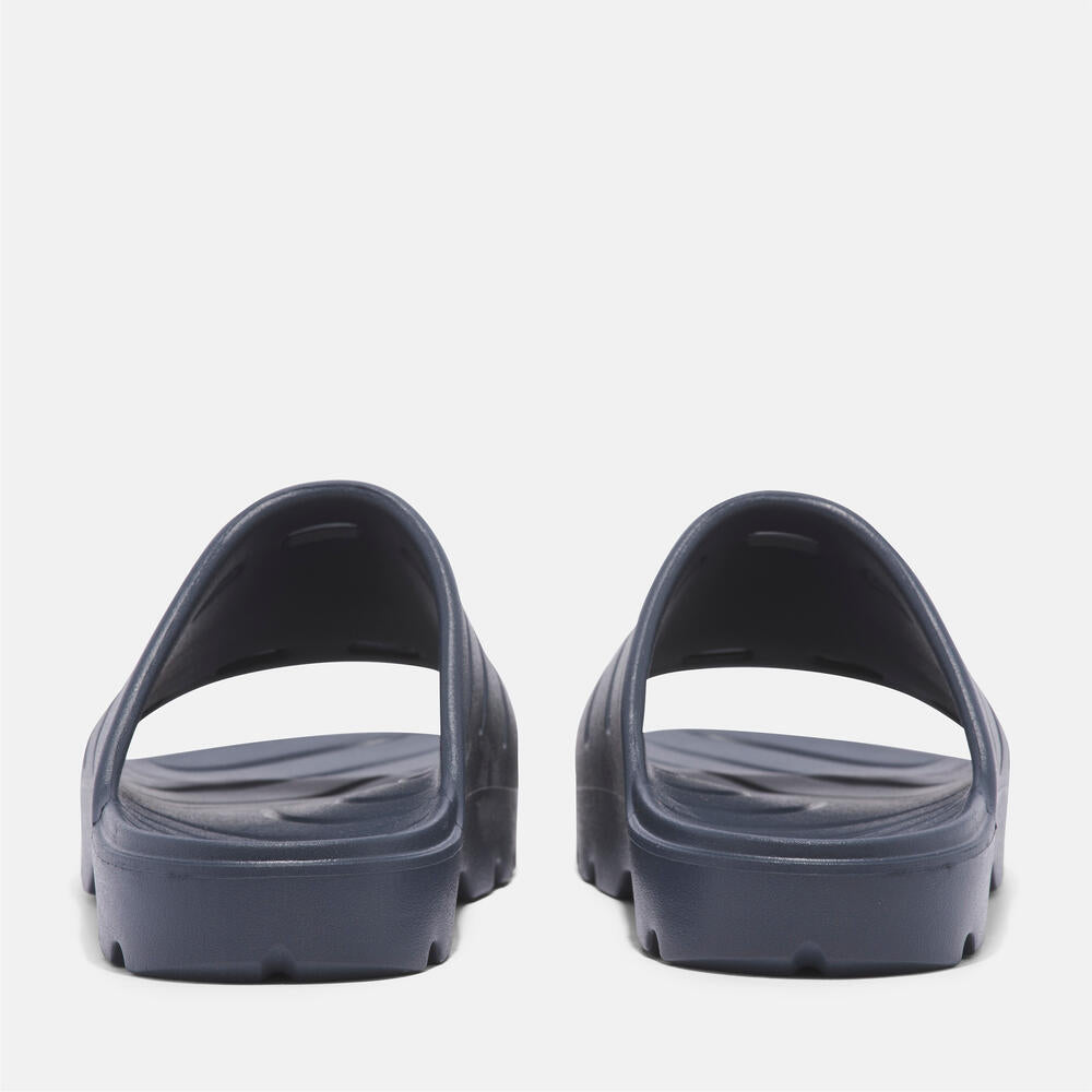 Timberland Get Outslide Slide Sandal for Men in Dark Blue. Dark blue slide sandal with one-piece EVA upper and outsole for lightweight comfort.  Perfect for casual wear and lounging