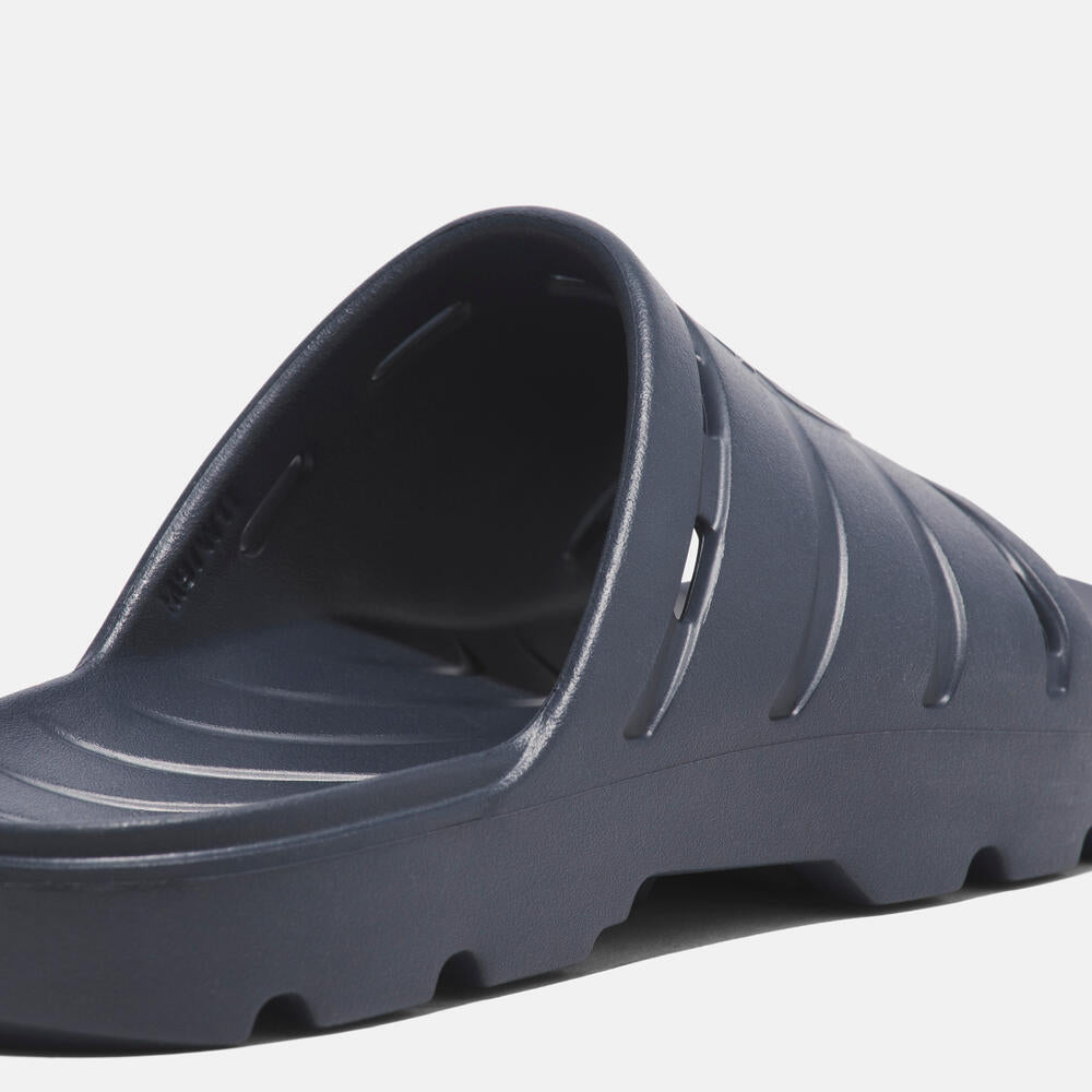 Timberland Get Outslide Slide Sandal for Men in Dark Blue. Dark blue slide sandal with one-piece EVA upper and outsole for lightweight comfort.  Perfect for casual wear and lounging