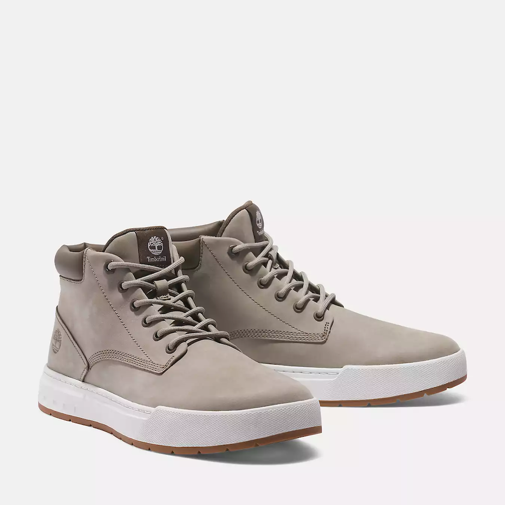 Timberland Maple Grove Mid Lace Up Sneaker for Men. Light taupe colored nubuck sneaker with lace-up closure, padded collar for comfort, and rubber sole for traction.  Pairs well with casual outfits.