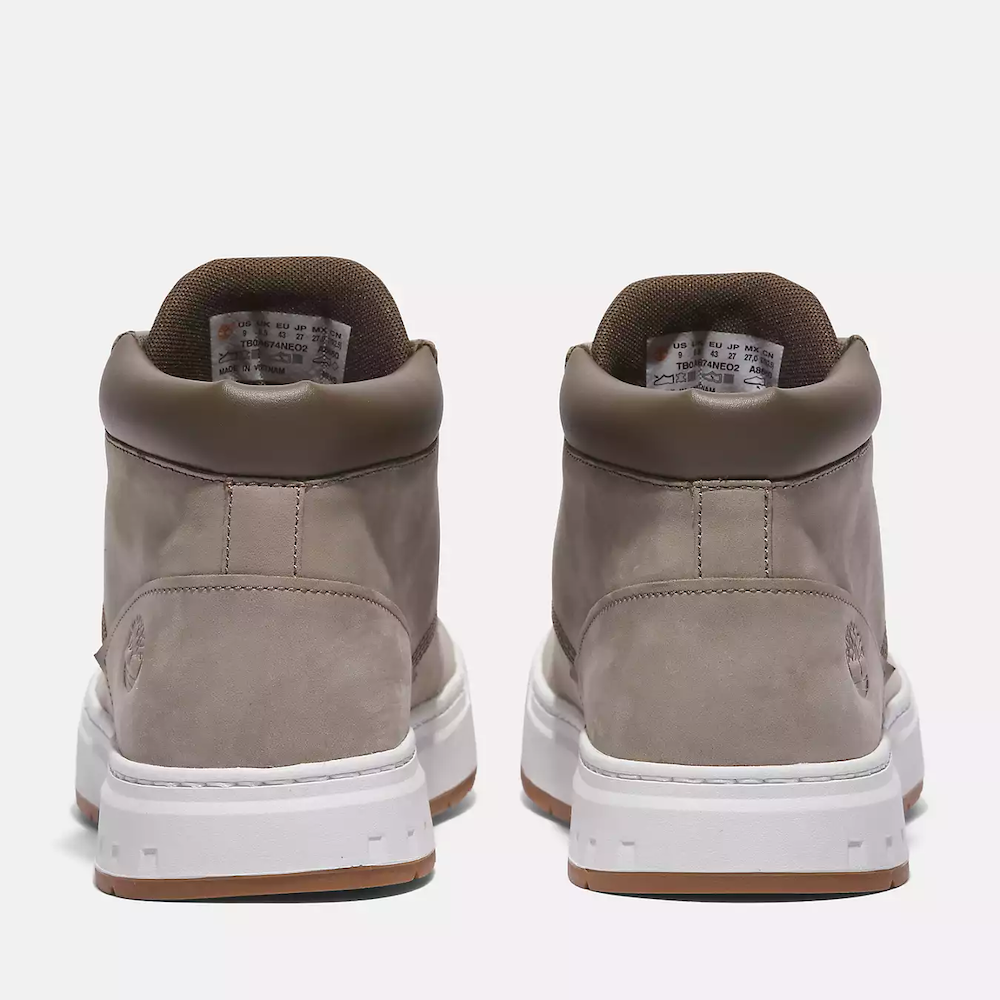 Timberland Maple Grove Mid Lace Up Sneaker for Men. Light taupe colored nubuck sneaker with lace-up closure, padded collar for comfort, and rubber sole for traction.  Pairs well with casual outfits.