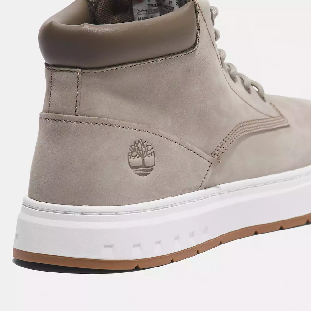 Timberland Maple Grove Mid Lace Up Sneaker for Men. Light taupe colored nubuck sneaker with lace-up closure, padded collar for comfort, and rubber sole for traction.  Pairs well with casual outfits.