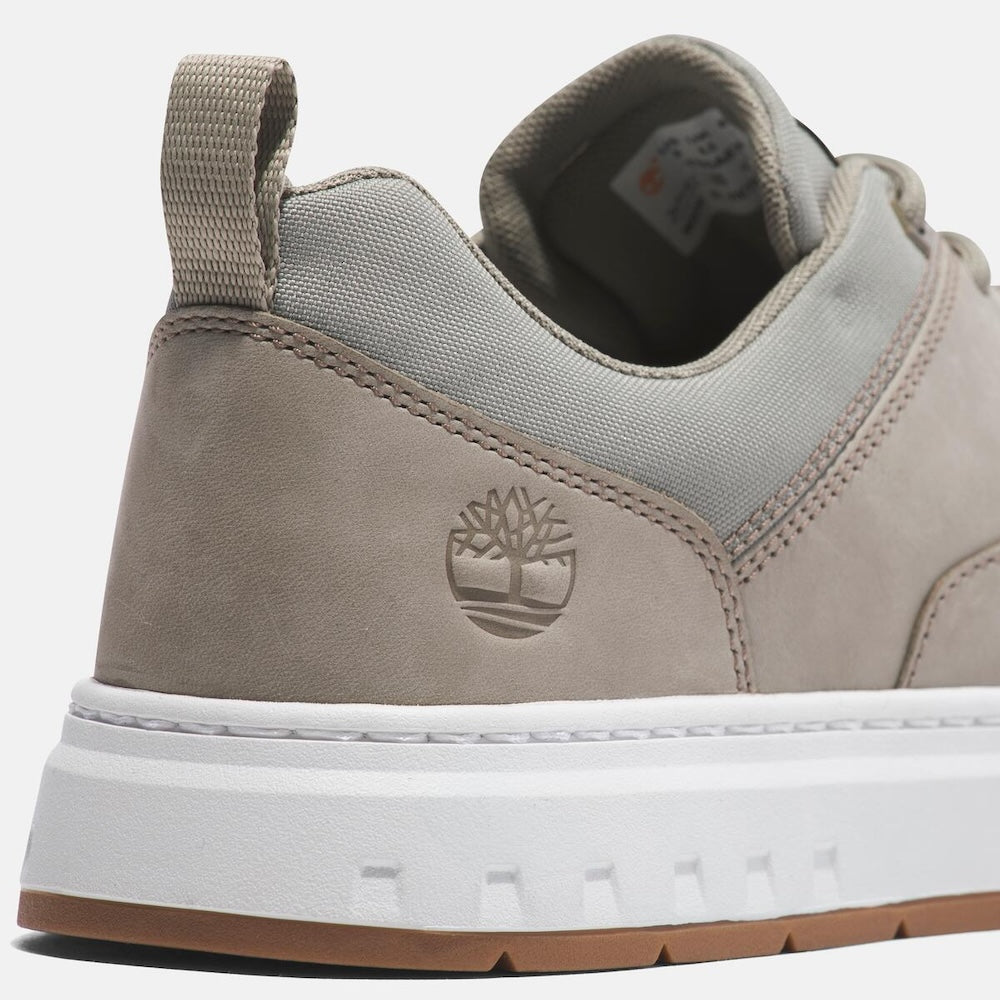 Timberland¡ Maple Grove Low Lace Up Sneaker for Men. Light taupe colored full grain leather sneaker with lace-up closure, comfortable lining made with recycled materials, and rubber outsole for traction. Perfect for everyday wear.