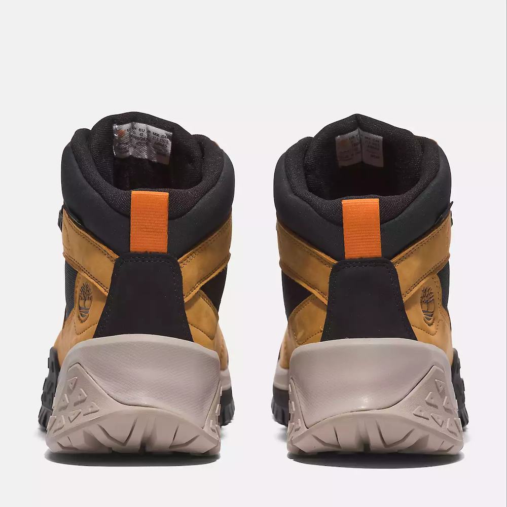 Wheat Timberland Motion Scramble Waterproof Boot. Leather & CORDURA upper for durability. Cushioned midsole & footbed. GreenStride soles for traction & eco-friendliness. TimberGrip outsole for grip. Mid-cut design. Lace-up closure. Wheat colour.