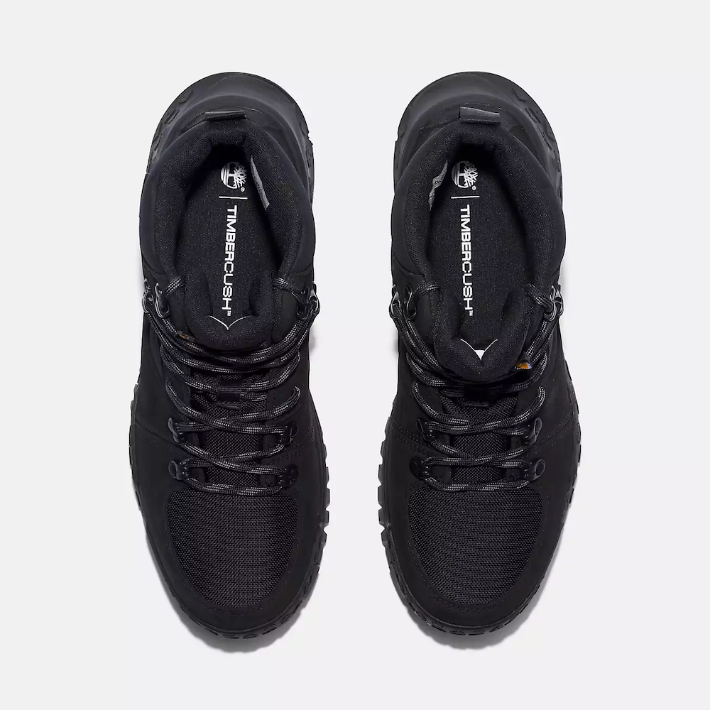 Black Timberland Motion Scramble Waterproof Boot. Leather & CORDURA upper for durability in black. Cushioned midsole & footbed. GreenStride soles for traction & eco-friendliness. TimberGrip outsole for grip. Mid-cut design. Lace-up closure.