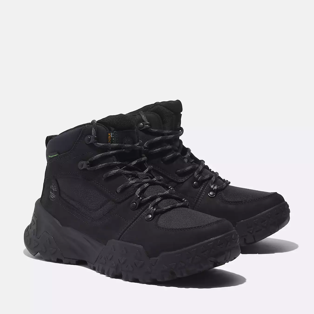 Black Timberland Motion Scramble Waterproof Boot. Leather & CORDURA upper for durability in black. Cushioned midsole & footbed. GreenStride soles for traction & eco-friendliness. TimberGrip outsole for grip. Mid-cut design. Lace-up closure.