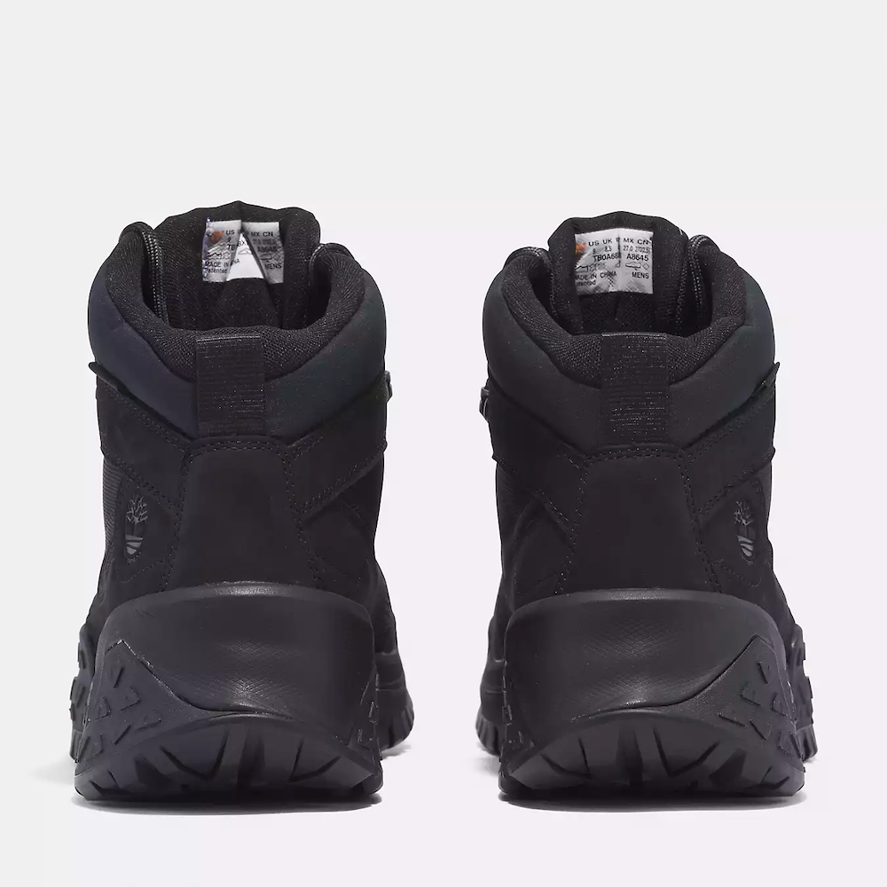 Black Timberland Motion Scramble Waterproof Boot. Leather & CORDURA upper for durability in black. Cushioned midsole & footbed. GreenStride soles for traction & eco-friendliness. TimberGrip outsole for grip. Mid-cut design. Lace-up closure.