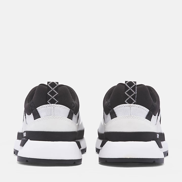 White Timberland Euro Trekker Lace-Up Low Trainer for Men. Upper made with ReBOTL fabric containing recycled plastic for sustainability and breathability. Lightweight OrthoLite footbed for cushioning. Cushioned midsole for shock absorption and energy return. Lace-up closure for secure fit. Clean white upper for versatile style. Durable rubber outsole for traction.