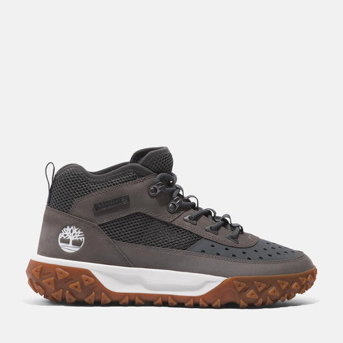 Grey Timberland‚¡ GreenStrideMotion 6 Waterproof Boot. Upper with recycled materials for eco-conscious design. TimberDrymembrane for waterproof protection. GreenStridecomfort soles for cushioning and sustainability. Durable rubber outsole with lugs for traction. Supportive mid-cut design for stability. Grey color for versatile style.