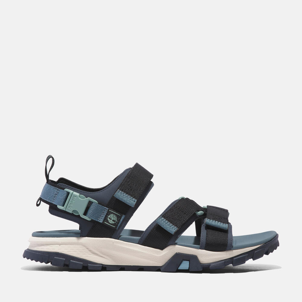 Timberland® Garrison Trail Two-Strap Sandal for Men in Blue. Blue sandal with ReBOTL fabric upper, two straps, and lightweight construction.  Ideal for warm weather adventures.