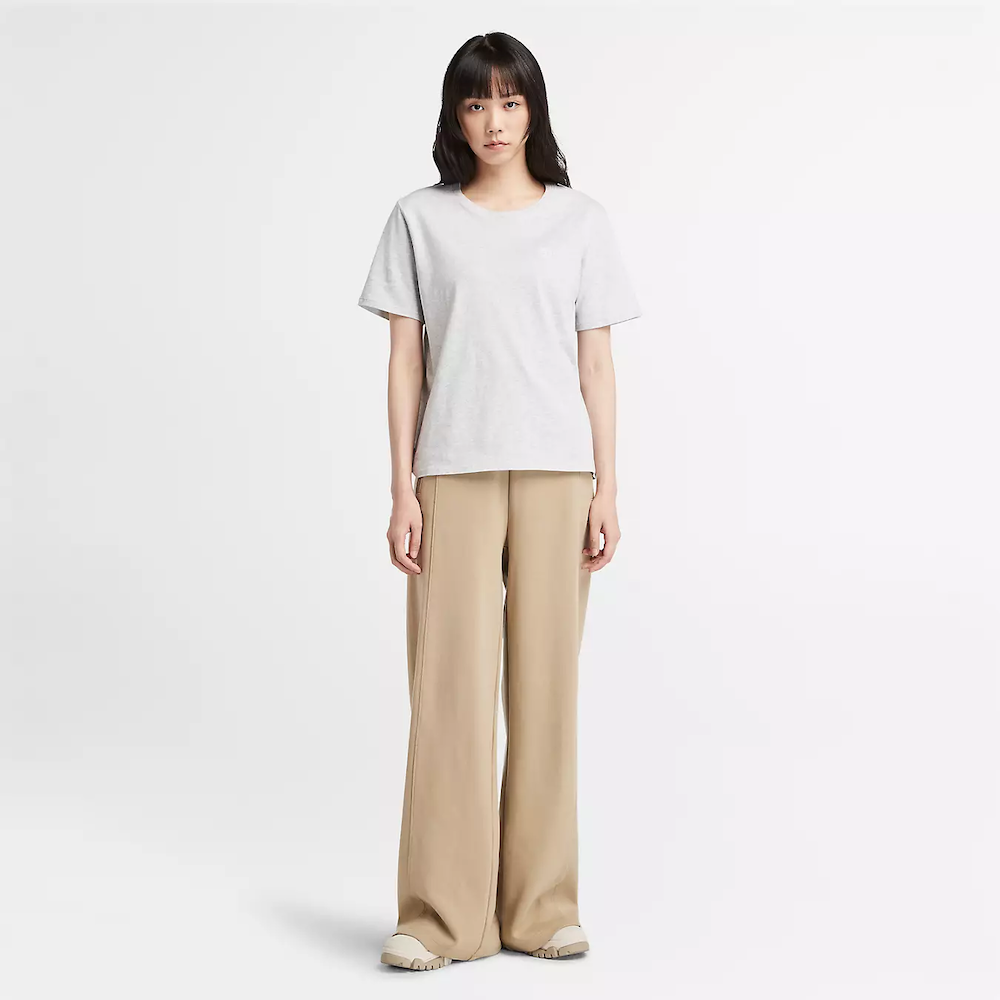 Light grey Timberland Dunstan Short Sleeve Tee for Women. Crewneck t-shirt made from 100% cotton featuring a relaxed, regular fit for comfortable wear.  A ribbed collar adds structure, while a small embroidered Timberland tree logo sits on the chest