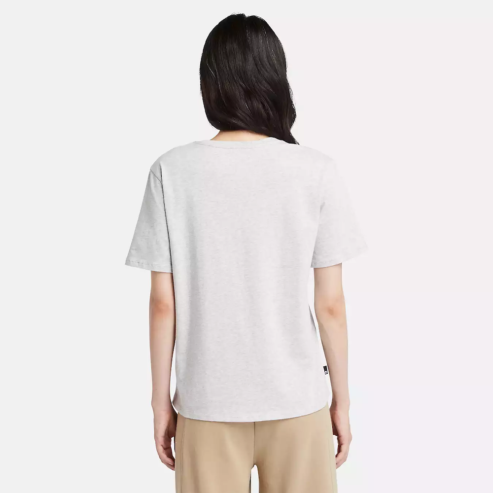 Light grey Timberland Dunstan Short Sleeve Tee for Women. Crewneck t-shirt made from 100% cotton featuring a relaxed, regular fit for comfortable wear.  A ribbed collar adds structure, while a small embroidered Timberland tree logo sits on the chest