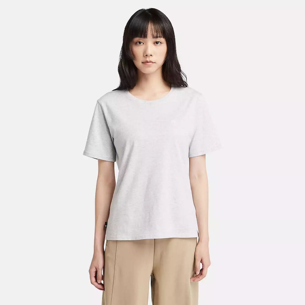 Light grey Timberland Dunstan Short Sleeve Tee for Women. Crewneck t-shirt made from 100% cotton featuring a relaxed, regular fit for comfortable wear.  A ribbed collar adds structure, while a small embroidered Timberland tree logo sits on the chest