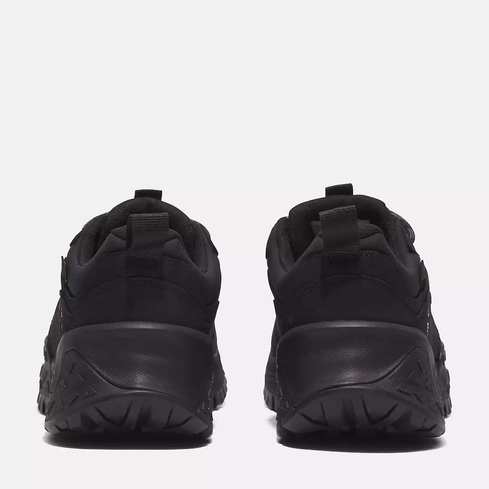 Timberland¡ Motion Scramble Waterproof Hiker for Men. Black hiking shoe featuring waterproof leather and fabric upper, lace-up closure for a secure fit, TimberDrywaterproof membrane for dry feet, TimberCushcomfort system for support, and GreenStridesoles made with recycled materials for eco-conscious traction.