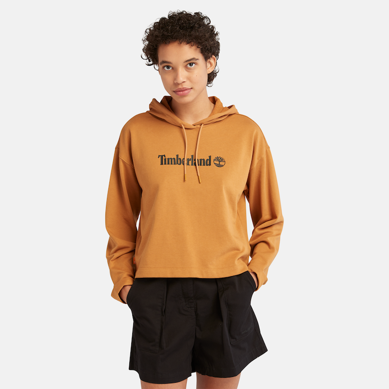 TIMBERLAND LINEAR LOGO RELAXED FIR CROPPED HOODIE FOR WOMEN IN WHEAT