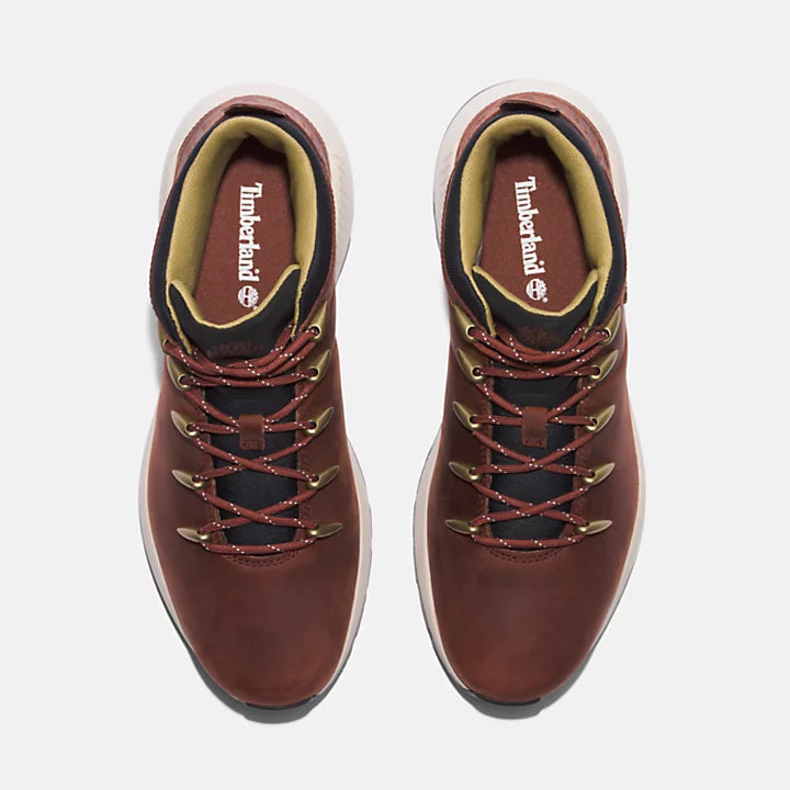 Medium brown Timberland Sprint Trekker Boot. Lightweight upper with water-resistant leather & breathable mesh. Flexible support, cushioned comfort. Durable traction for various terrains. Classic look