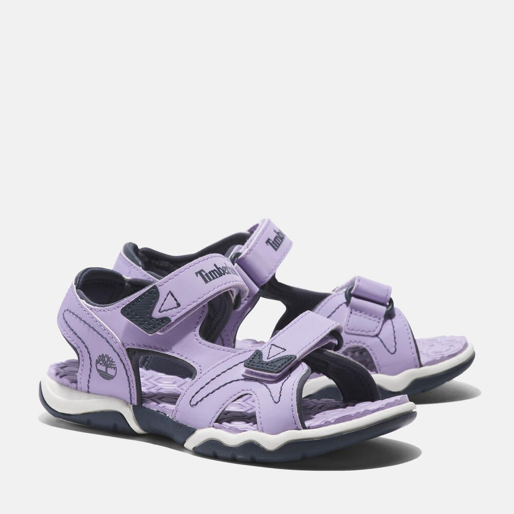 Timberland Adventure Seeker 2-Strap Sandal for Junior. Comfortable and stylish sandal with premium leather upper, hook-and-loop closure, and anti-odor treatment. Perfect for kids' adventures.