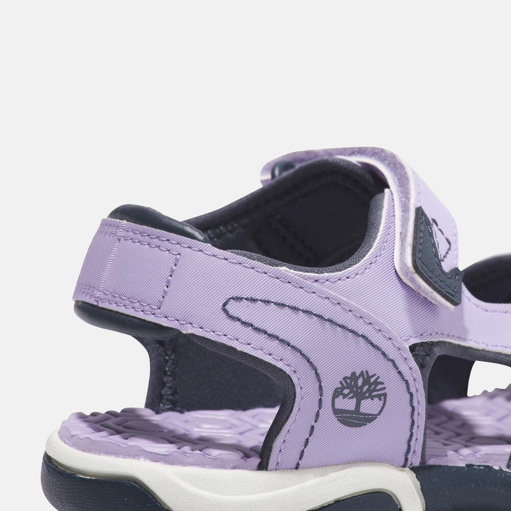 Timberland Adventure Seeker 2-Strap Sandal for Junior. Comfortable and stylish sandal with premium leather upper, hook-and-loop closure, and anti-odor treatment. Perfect for kids' adventures.