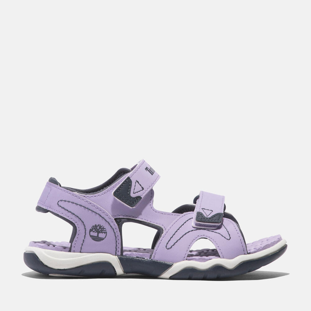Timberland Adventure Seeker 2-Strap Sandal for Junior. Comfortable and stylish sandal with premium leather upper, hook-and-loop closure, and anti-odor treatment. Perfect for kids' adventures.