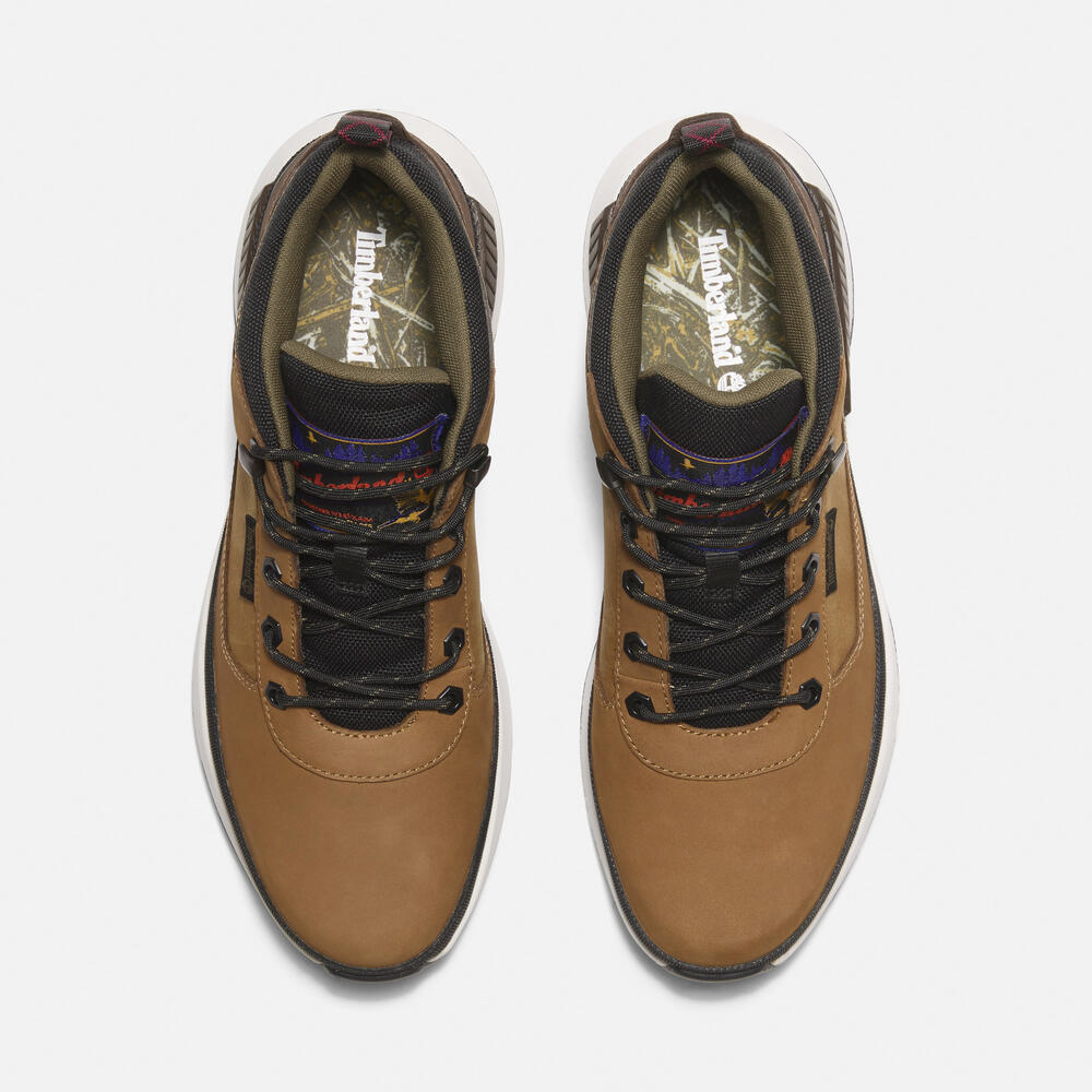 Timberland Field Trekker Mid Lace-Up Trainer for Men in Brown. Brown leather trainer with ReBOTL lining and OrthoLite footbed.  Mid-cut design for added support.