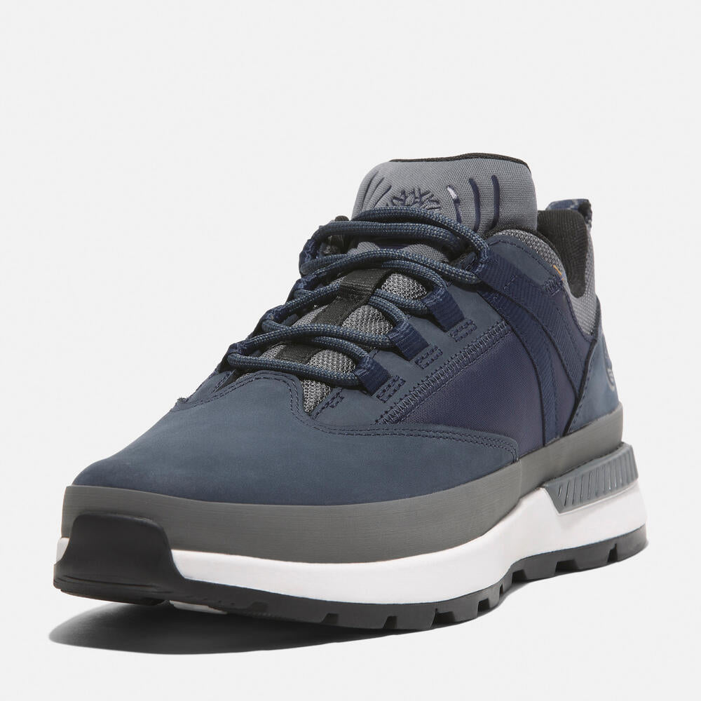 Timberland® Euro Trekker Low Lace-Up Sneaker for Men in Navy. Navy sneaker with lace-up closure. Comfortable and stylish for everyday wear.